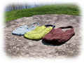 Trio of Janet Leigh Bags on a Rock